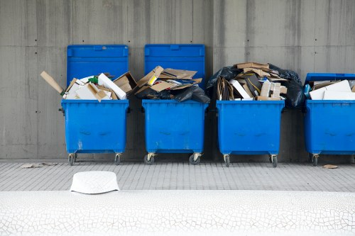 Workers sorting items for recycling during a flat clearance in Charlton
